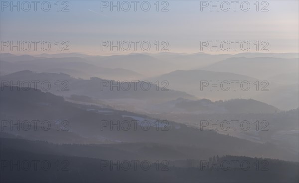 The hills of the northern Sauerland in the morning mist in Meschede