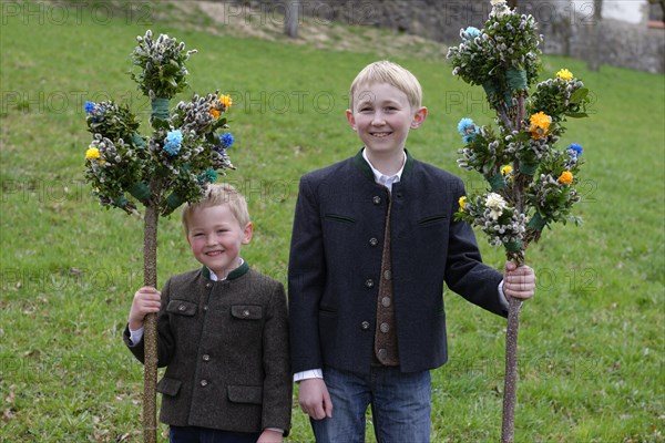 Two boys with palm branches