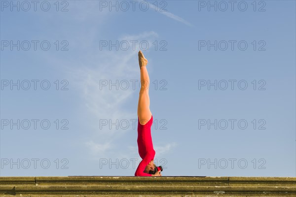 Young woman practising Hatha yoga