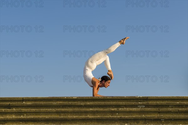 Young woman practising Hatha yoga