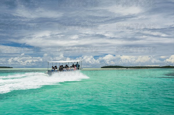 Tourist boat crossing an artificial canal