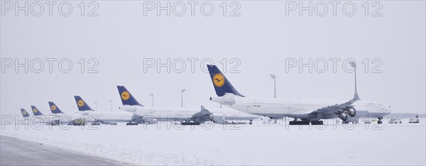 Lufthansa aircrafts in parking position in the snow