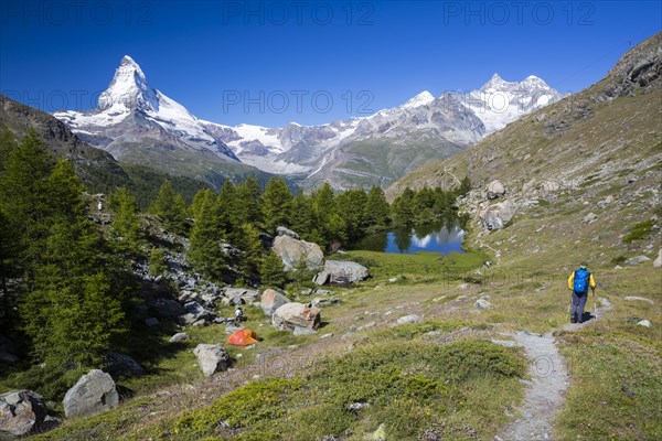 Hiker and a wild camper at Grindjisee lake