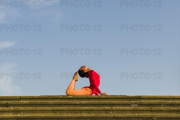 Young woman practising Hatha yoga