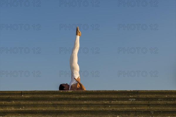 Young woman practising Hatha yoga