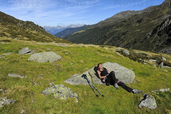 Woman resting after a mountain hike