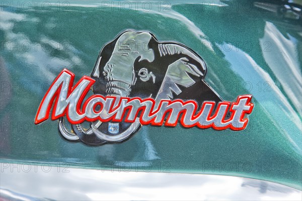 The logo on the motorcycle tank of the Munch 4 Mammut TTS-E