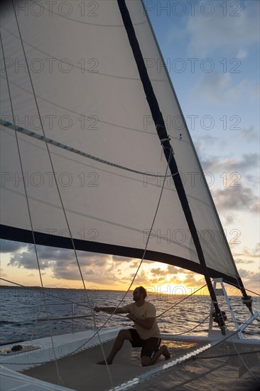 Skipper checking the tension of the sails