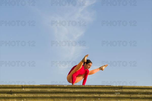 Young woman practising Hatha yoga