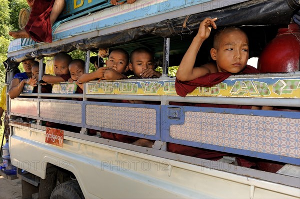 Buddhist child monks taking the school bus