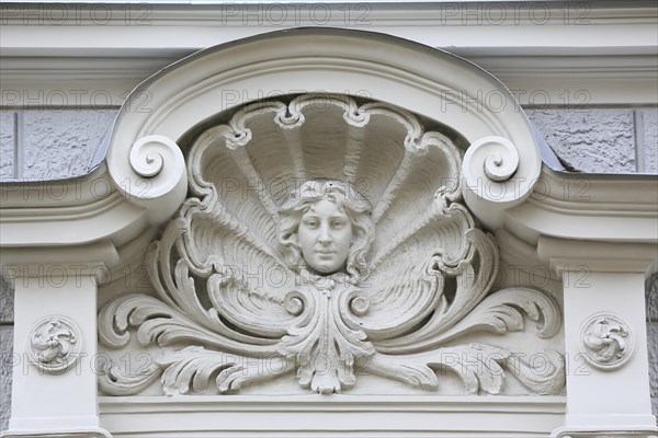 Head of a Woman in a shell above the entrance