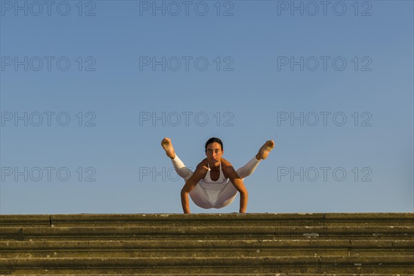 Young woman practising Hatha yoga