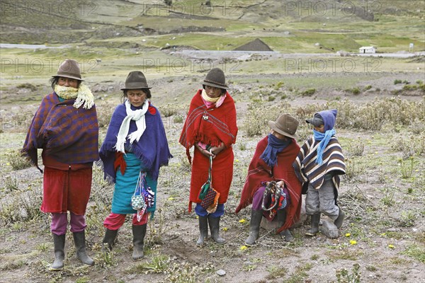 Girls with traditional felt hats offer handmade souvenirs for sale