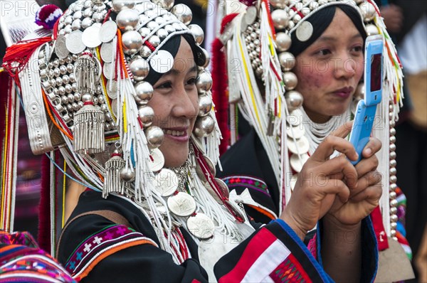 Traditionally dressed smiling young woman from the Akha people