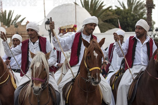 Men on horseback