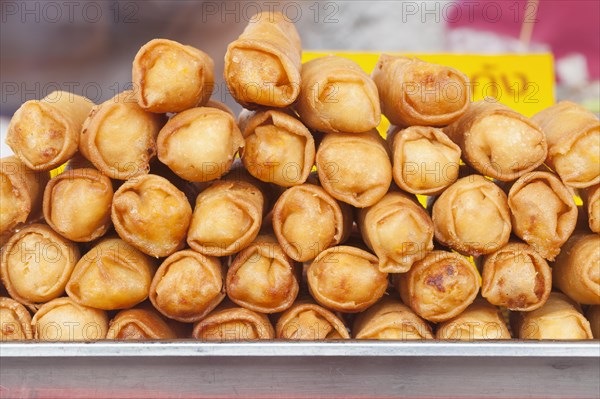 Spring rolls on sale at a market