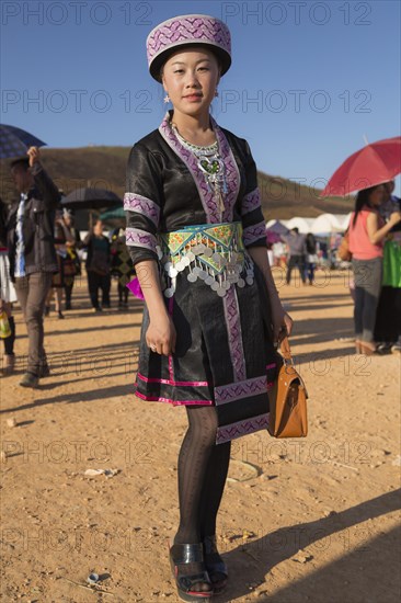 Young woman dressed in a traditional Hmong costume
