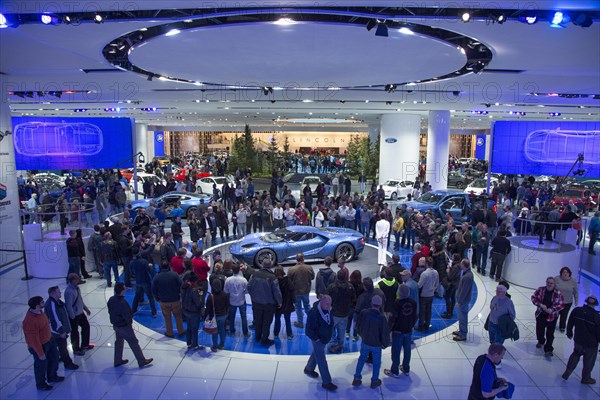 Visitors to the North American International Auto Show around the 2016 carbon fiber Ford GT