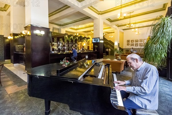 Hotel lobby with a piano player