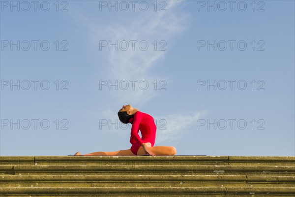 Young woman practising Hatha yoga