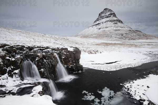 Kirkjufell mountain with waterfall