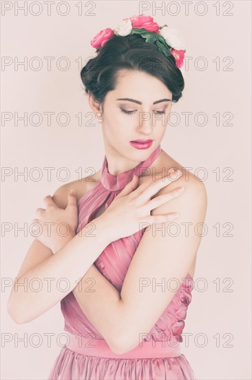 Beauty portrait of a young woman with flowers in her hair