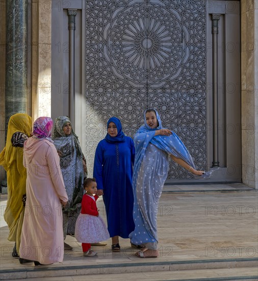 Moroccan women in front of the mosque Hassan II