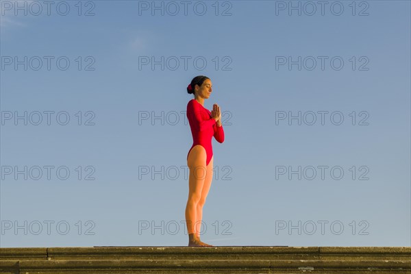 Young woman practising Hatha yoga