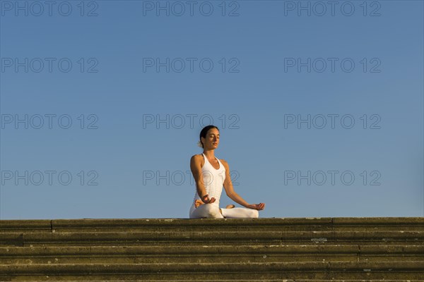 Young woman practising Hatha yoga