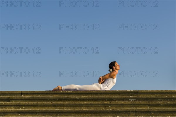 Young woman practising Hatha yoga