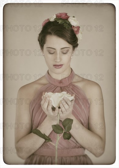 Beauty portrait of a young woman with flowers in her hair