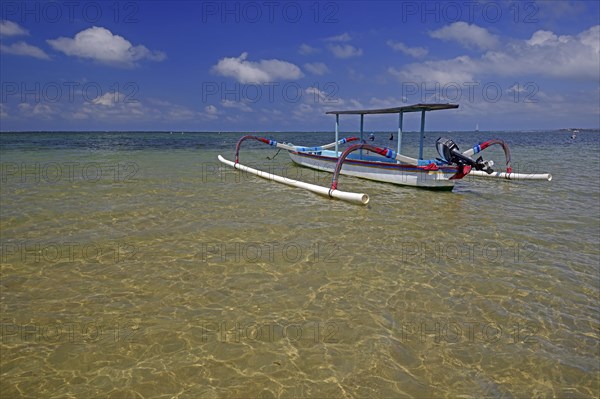 Traditional outrigger boat on the beach