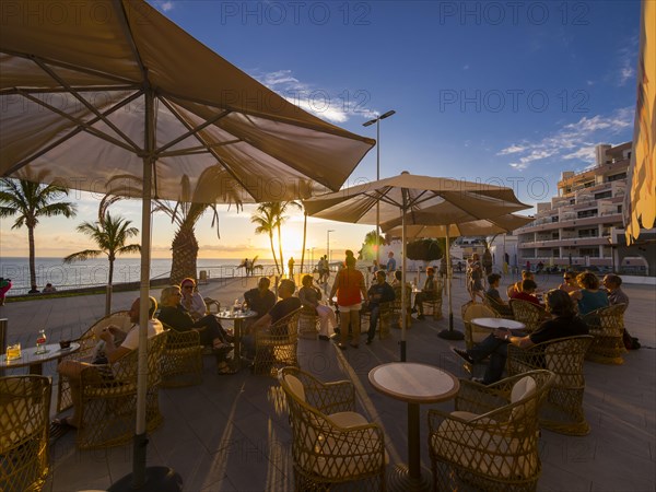 Beach promenade with restaurants in the evening