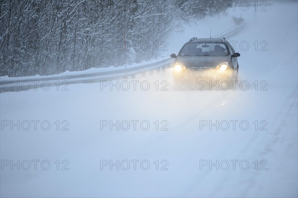 Truck driving on snowy road