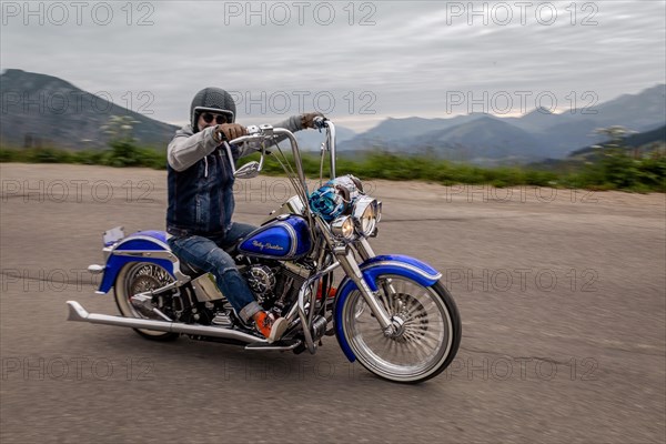 Man driving a Harley Davidson motorbike