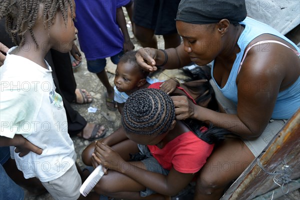 Women braiding plaits