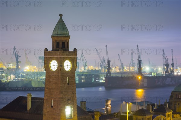 Tower of St. Pauli Landungsbrucken and the Elbe River at dusk