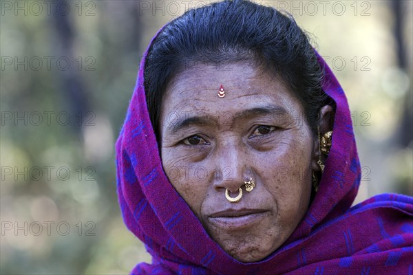 Nepalese woman with earrings and nose piercing