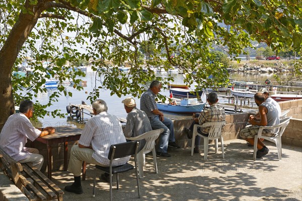 Men relaxing at the fishing port