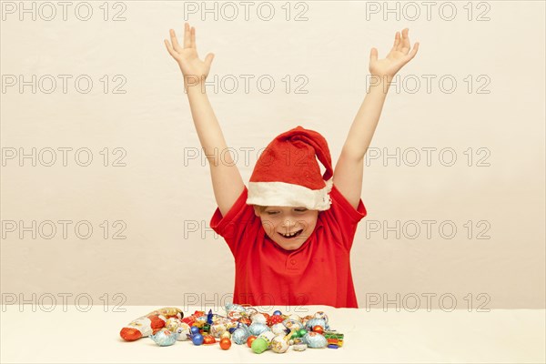 Boy in front of Christmas candies