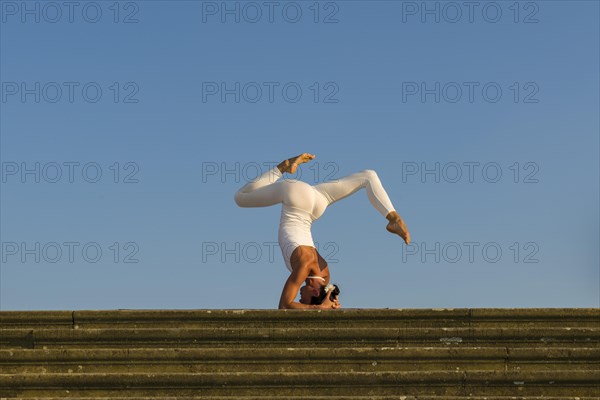 Young woman practising Hatha yoga