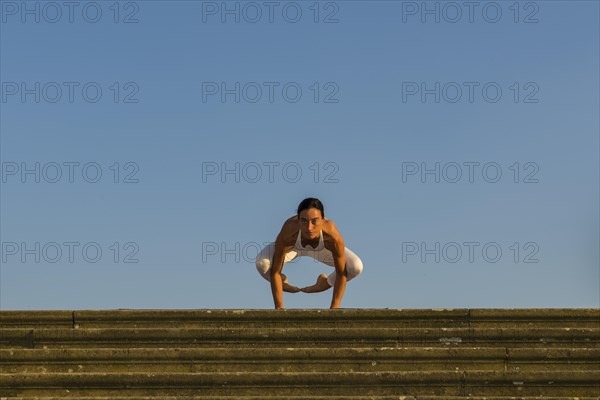 Young woman practising Hatha yoga