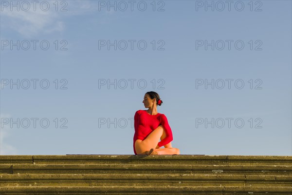 Young woman practising Hatha yoga