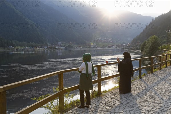 Tourists lake looking at lake Uzungol