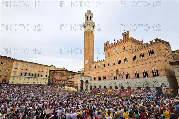 Piazza del Campo with Palazzo Publico on a training day of the Palio di Siena