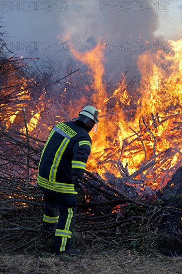 Firefighter lighting Easter fire