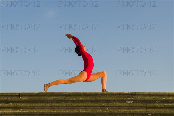 Young woman practising Hatha yoga