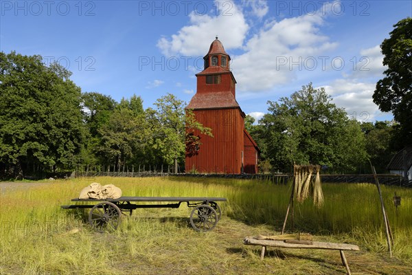 Wooden red Seglora Church or Seglora kyrka