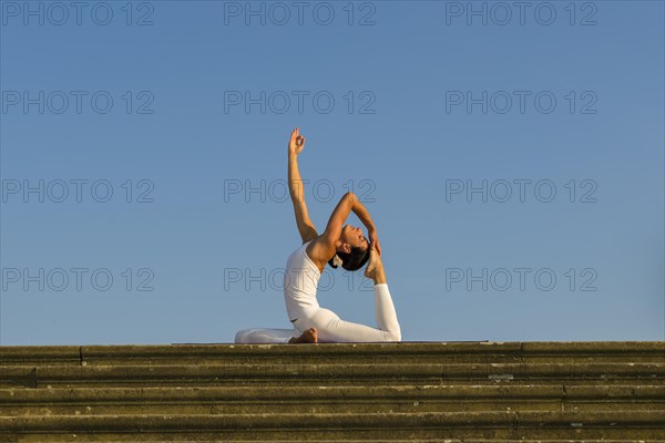 Young woman practising Hatha yoga