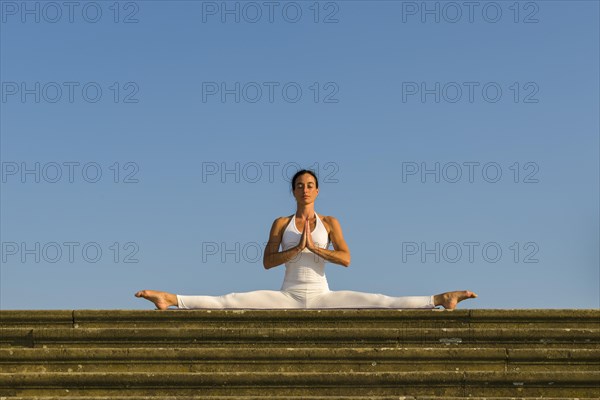 Young woman practising Hatha yoga